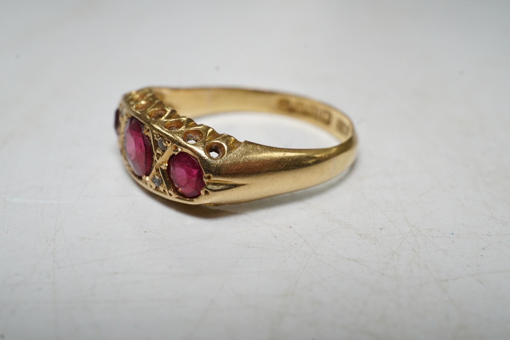 An 18ct gold, red doublet and diamond chip set dress ring, size N, gross 3 grams. Condition - poor.